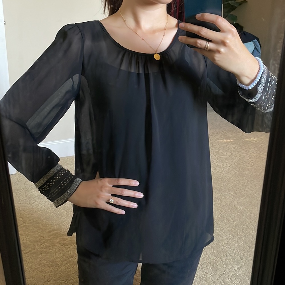 Sheer top with beaded sleeves